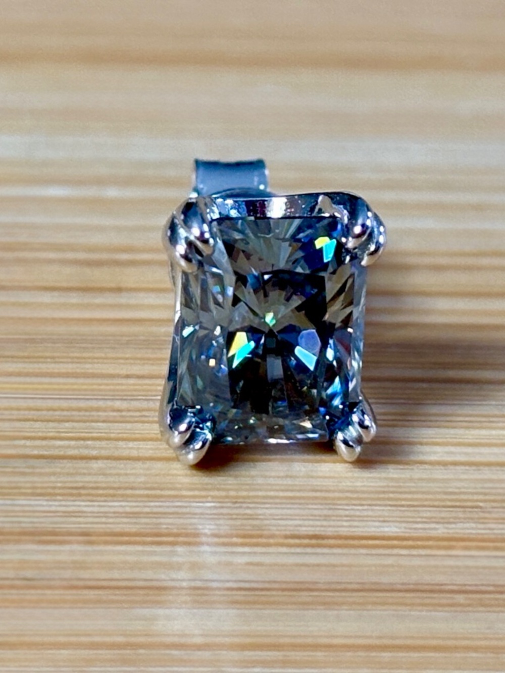 6ctw gray radiant Moissanite studs in sterling mountings with double claws!